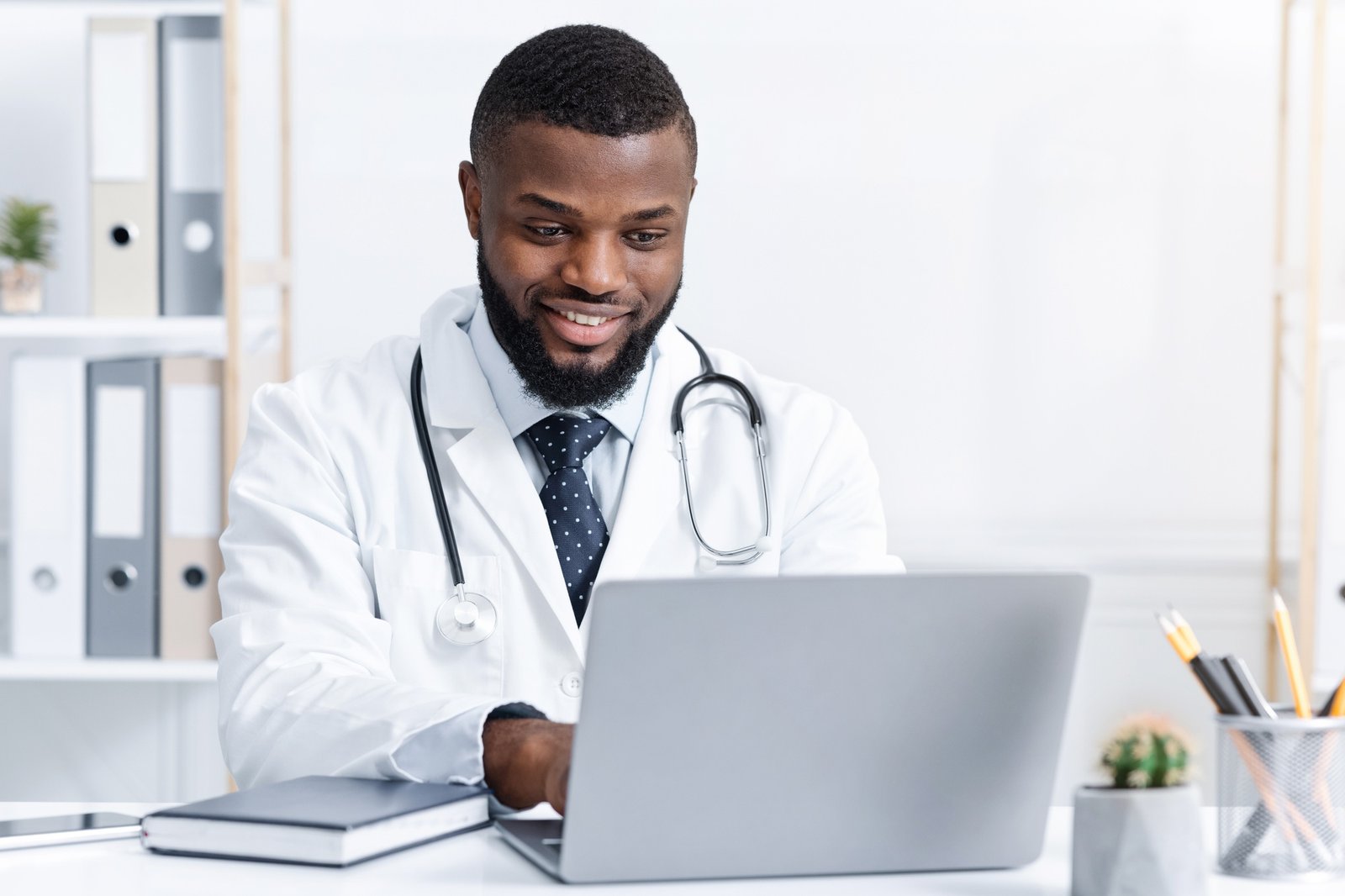 Highly qualified black doctor consultating patients online